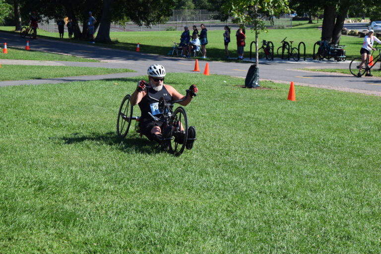 a man completing a 5k race in a recumbent bike