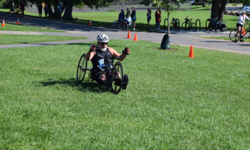 a man completing a 5k race in a recumbent bike