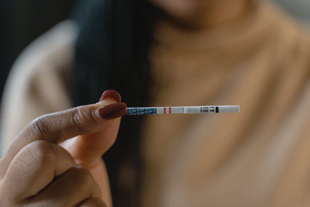 Person holding xylazine or fentanyl test strip as a method of harm reduction for substance use.