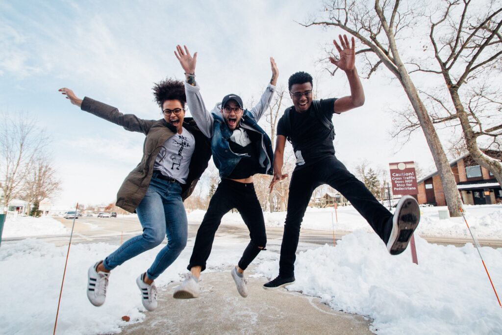 group of friends celebrating outside during the winter